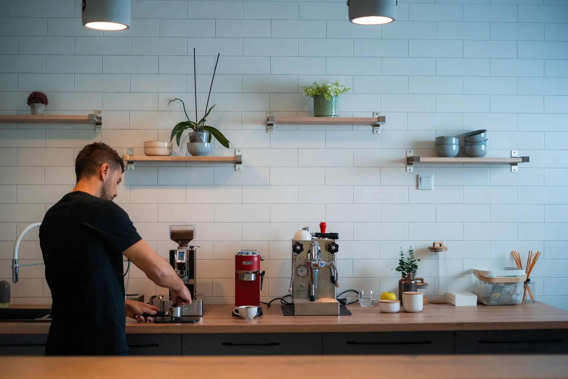 man making espresso coffee in a coworking space in Sarajevo.